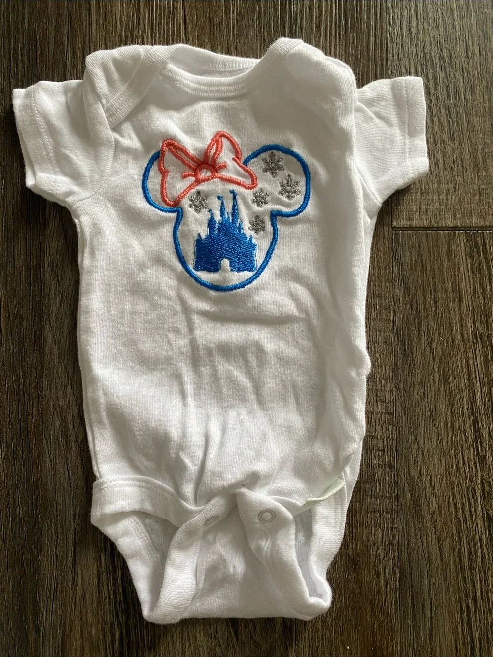 Home embroidered baby bodysuits